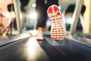 Close-up of Athlete shoes while running on treadmill
